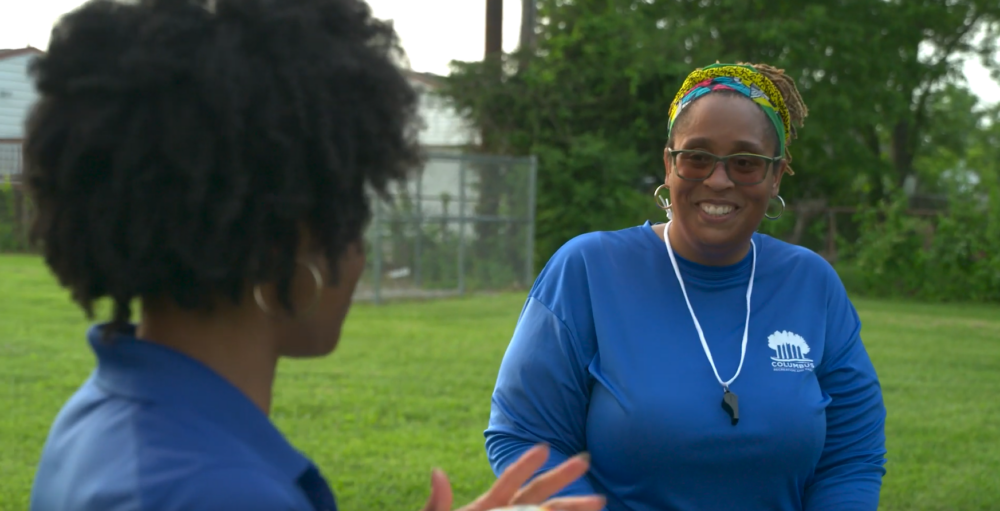 Coach Asha smiling